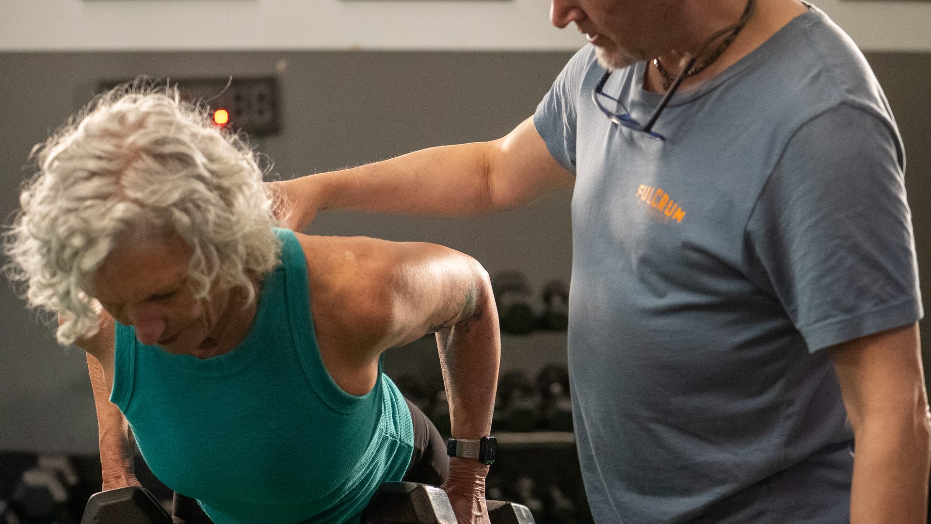 Coach working with a client on their return to fitness at Fulcrum