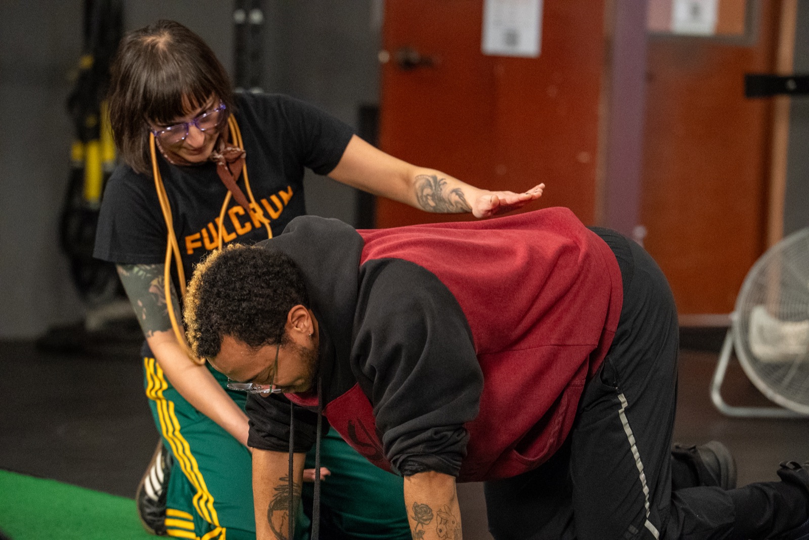 Personal training Portland Oregon — coach explaining movement mechanics and injury-safe exercise at Fulcrum Fitness